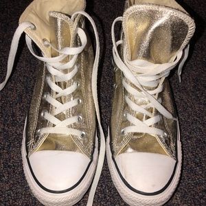 Gold high-top converse